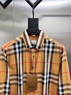 Long-sleeve plaid shirt close-up, button-front and embroidered chest detail