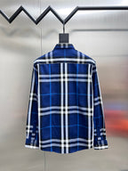 Long-sleeve button-up shirt in blue and white plaid, back view on hanger