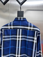 Back view of blue-and-white plaid long-sleeve button-up shirt with yoke