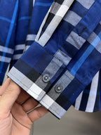 Long-sleeve cuff and sleeve end of blue-and-white plaid button-up shirt
