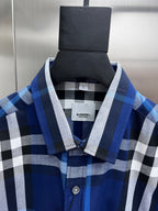 Blue and white plaid shirt collar with button placket, on hanger