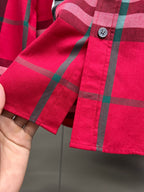 Red plaid long-sleeve shirt cuff with button and hem