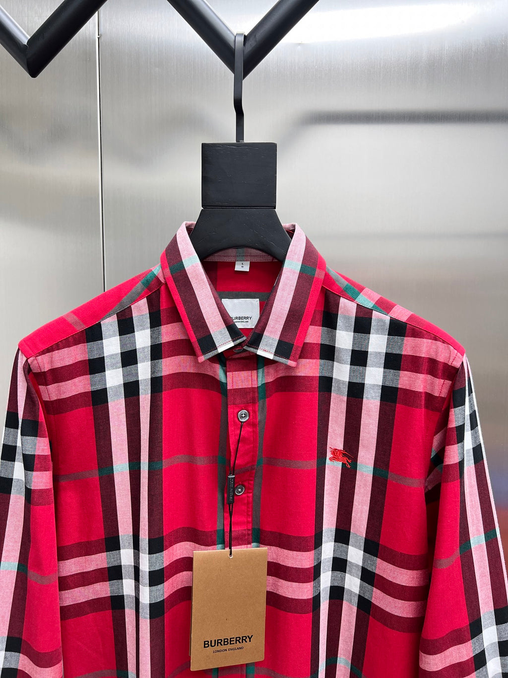 Red and black plaid long-sleeve button-up shirt with point collar and button placket