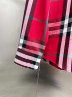 Red and black plaid shirt hem with long sleeves and side seam