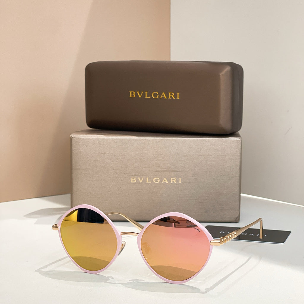 Pink round sunglasses with gradient tinted lenses and slim metal arms.
