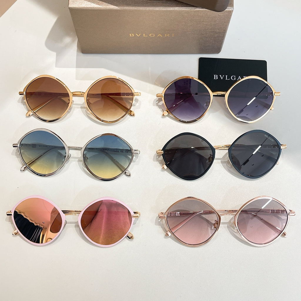 Assorted round sunglasses with different colored frames and tinted lenses.