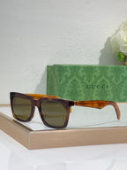 Tortoise Gucci square sunglasses with glossy frames and amber tinted lenses