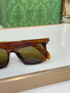 Tortoise Gucci sunglasses side close-up with amber tinted lenses