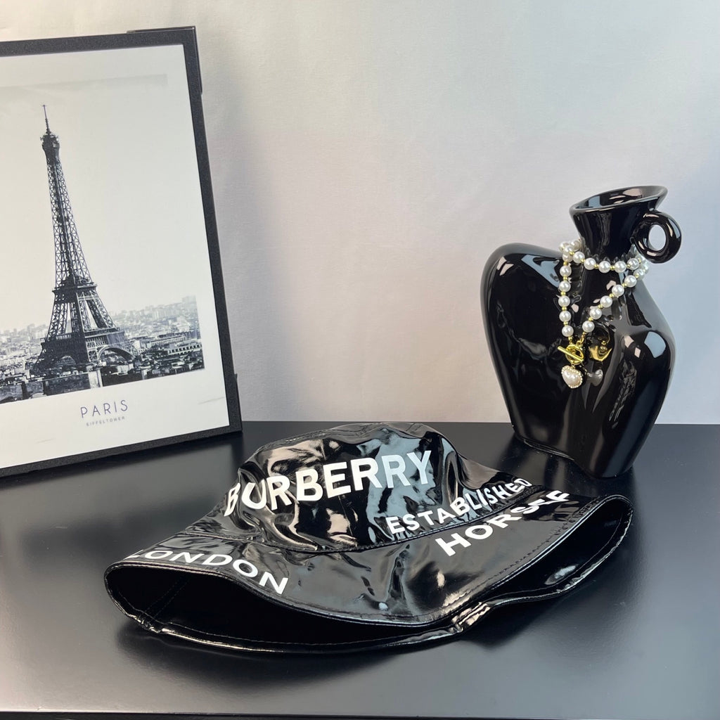 Glossy black bucket hat with brim text Burberry and London, side view