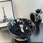 Glossy black bucket hat inside view with hanging size label