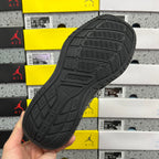 Black sneaker outsole with textured tread pattern