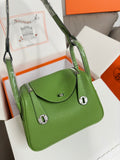 Green leather Hermes handbag with top handle and front flap, silver hardware