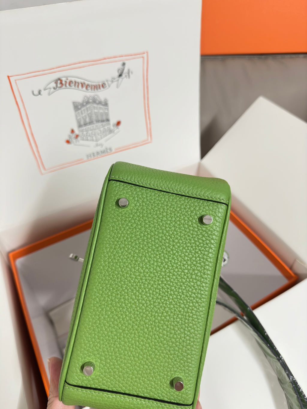 Green leather Hermes handbag back panel with corner studs and handle loop, silver hardware