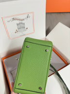 Green leather Hermes handbag back panel with corner studs and handle loop, silver hardware