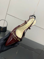 Ladies Dior burgundy patent slingback shoe with ankle strap and light interior lining