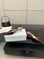 Ladies Dior burgundy pointed-toe slingback heels on display, slim stiletto heel