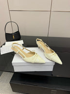 Ivory pointed-toe slingback pumps with slim heel and ankle strap