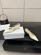 Ivory pointed-toe slingback heels with slim heel and light lining