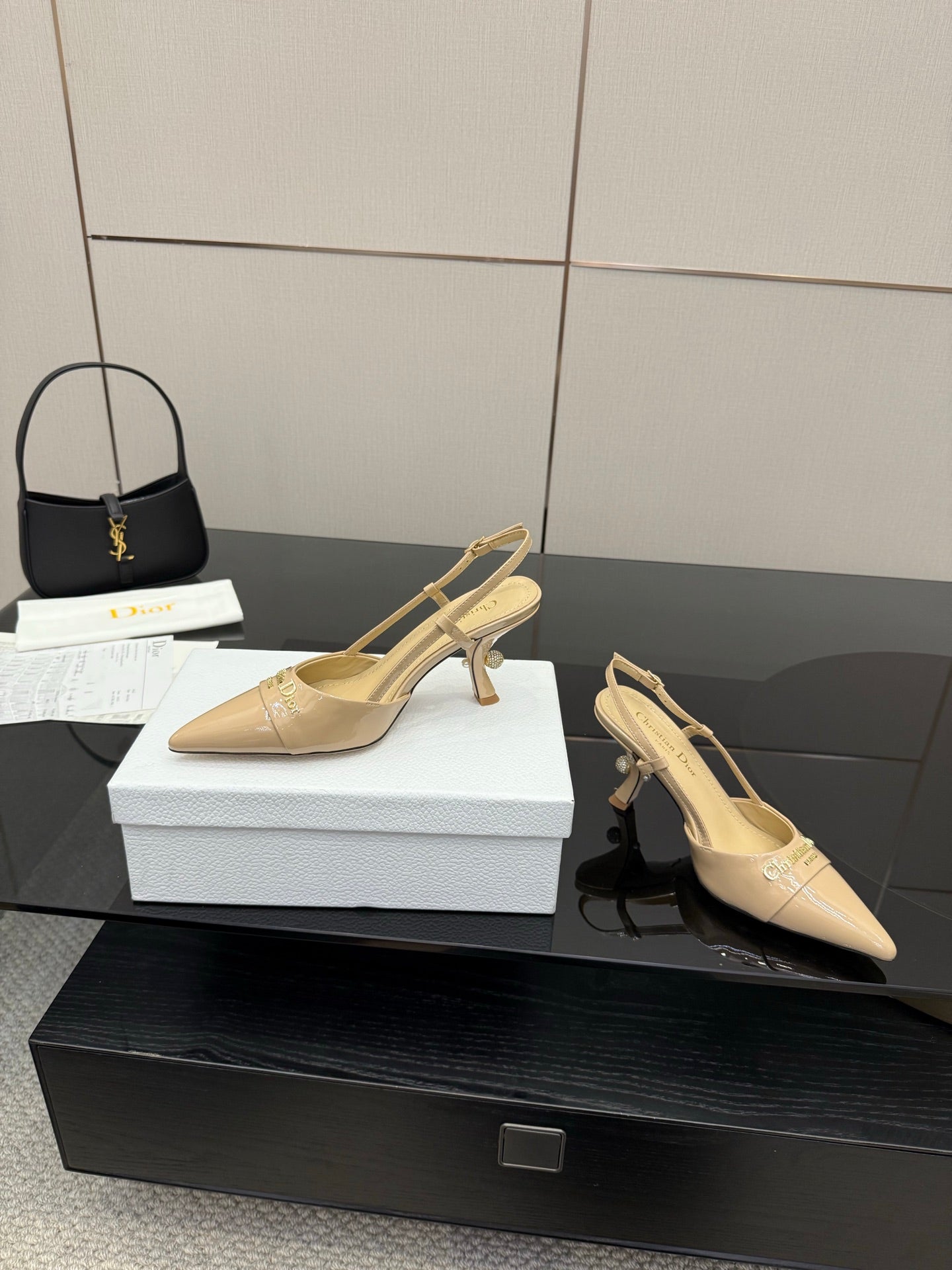 Beige point-toe slingback heels side view with covered heel and ankle strap
