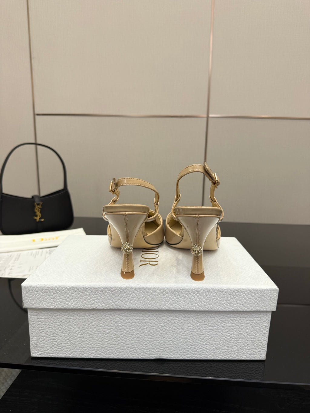 Beige point-toe slingback heels rear view with ankle strap and heel