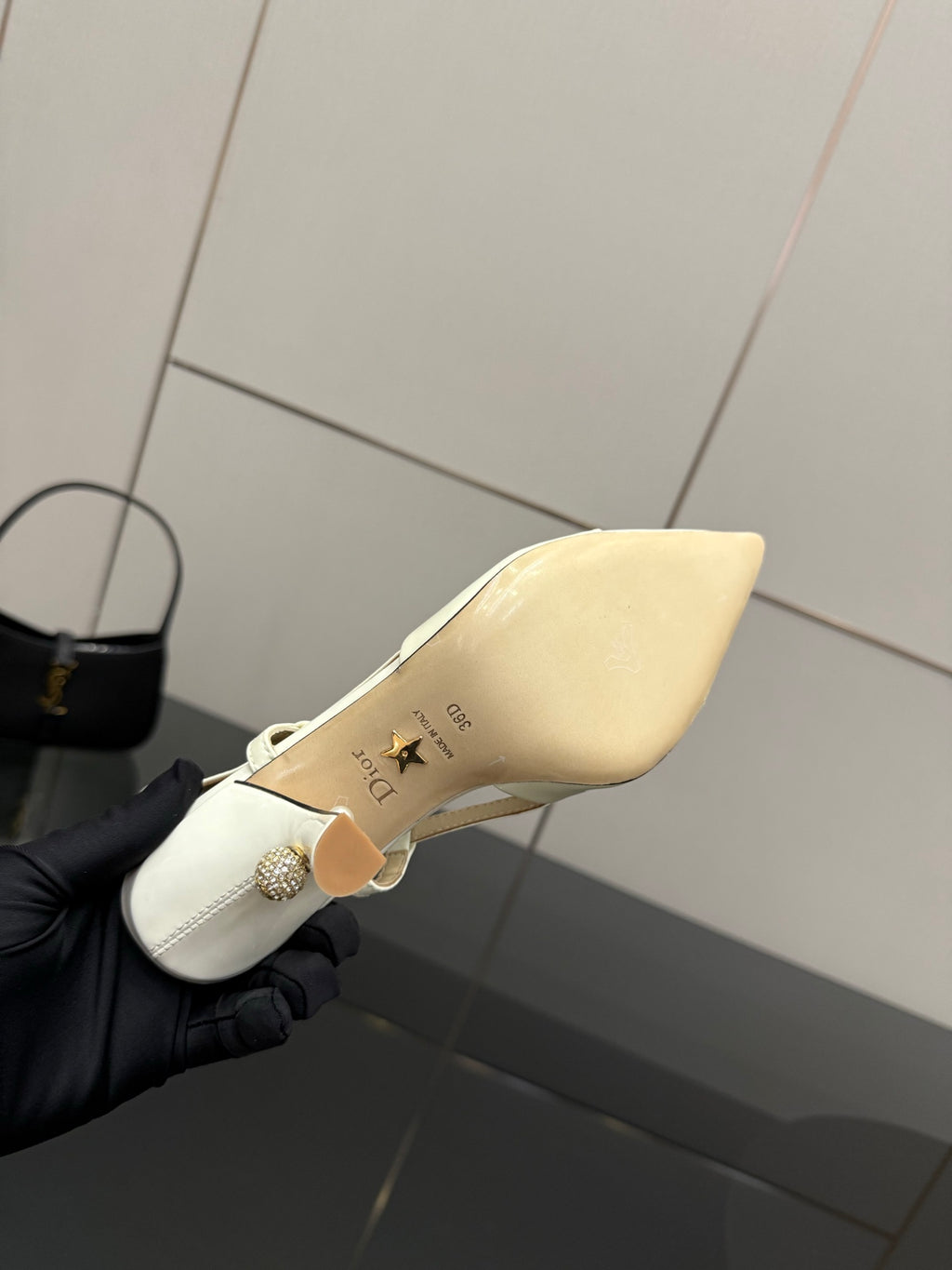 Ivory slingback pump sole and footbed shown, pointed toe, thin ankle strap