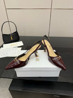 Dior ladies burgundy pointed-toe slingback heels shown at 3/4 angle.