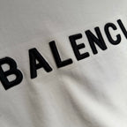 White T-shirt fabric with curved BALENCIAGA lettering