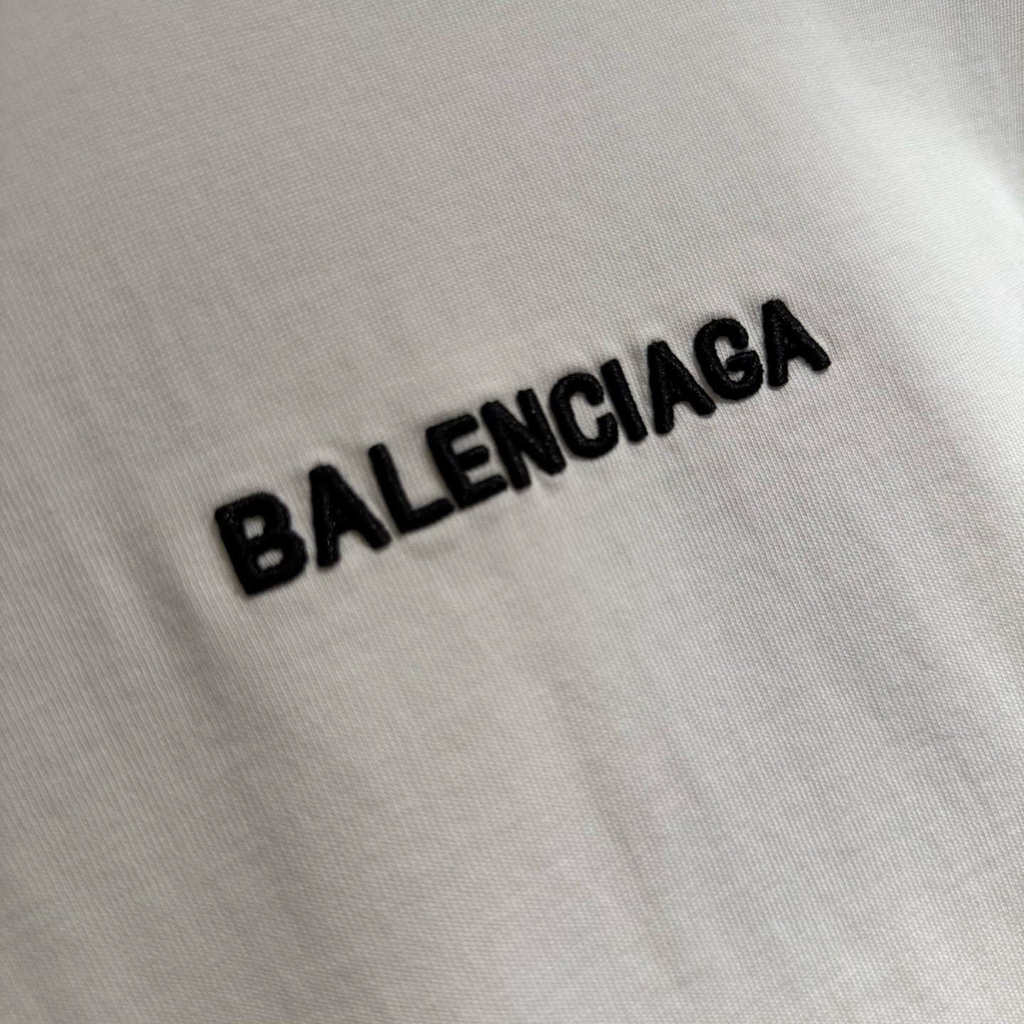 White T-shirt fabric with BALENCIAGA logo text