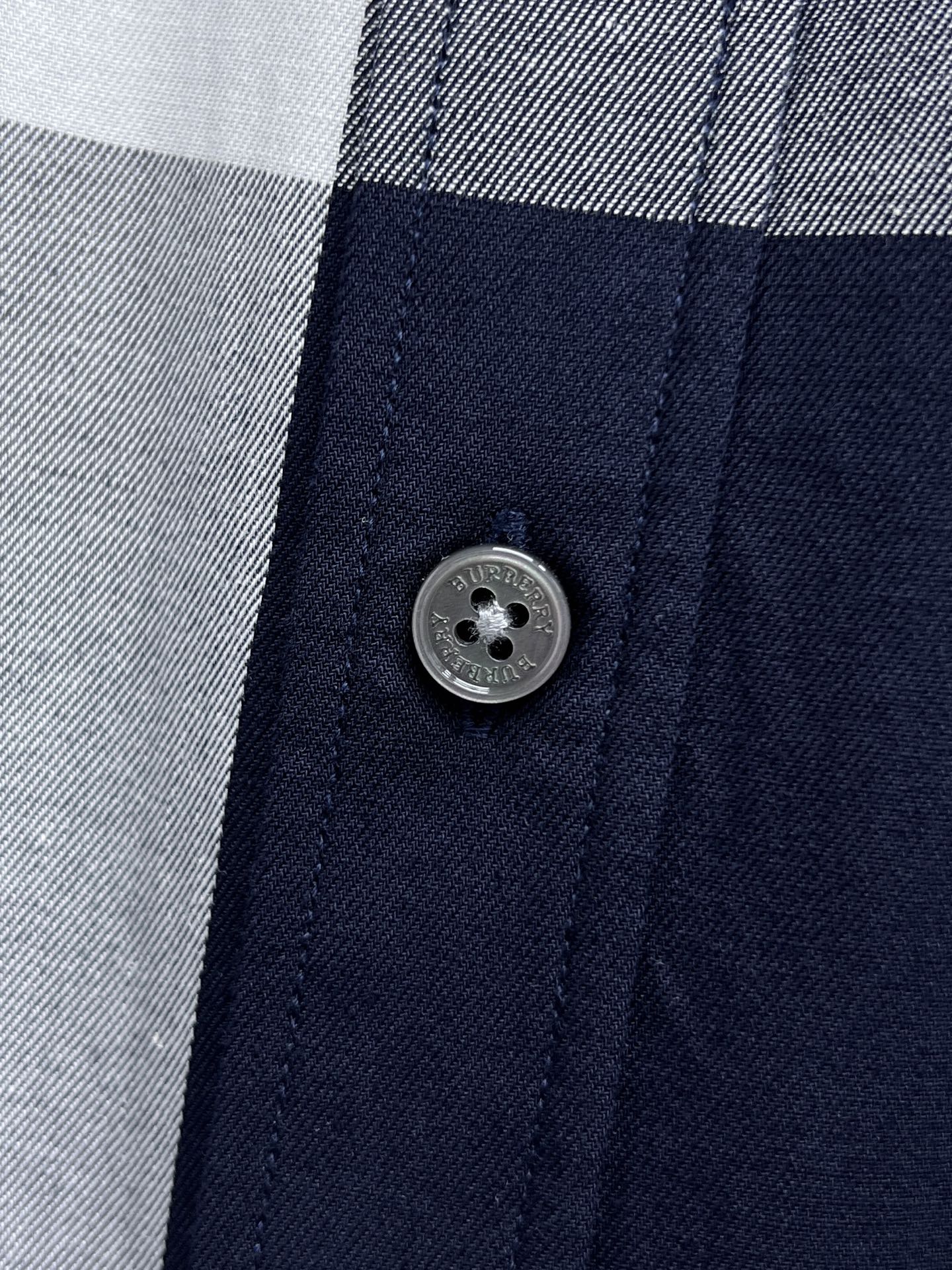 Long-sleeve plaid shirt close-up of front button and placket