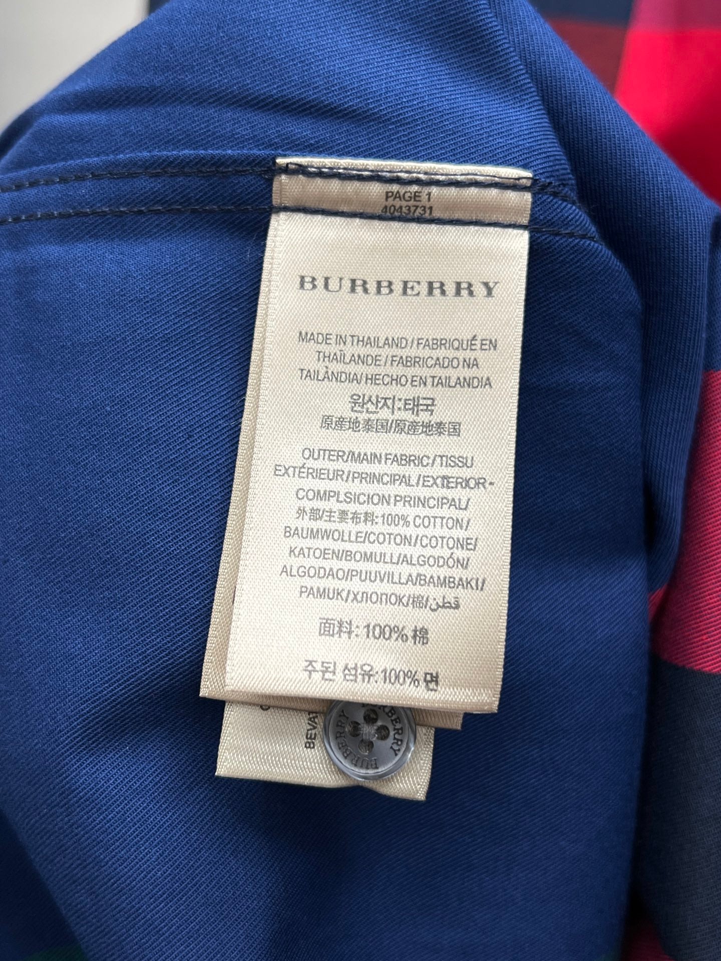Burberry clothing size and care label on blue plaid shirt collar