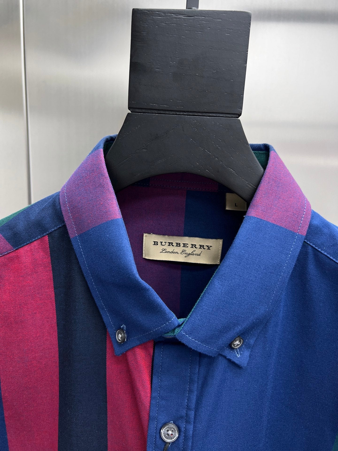 Plaid long-sleeve button-up shirt with Burberry label on blue, red, and purple checks
