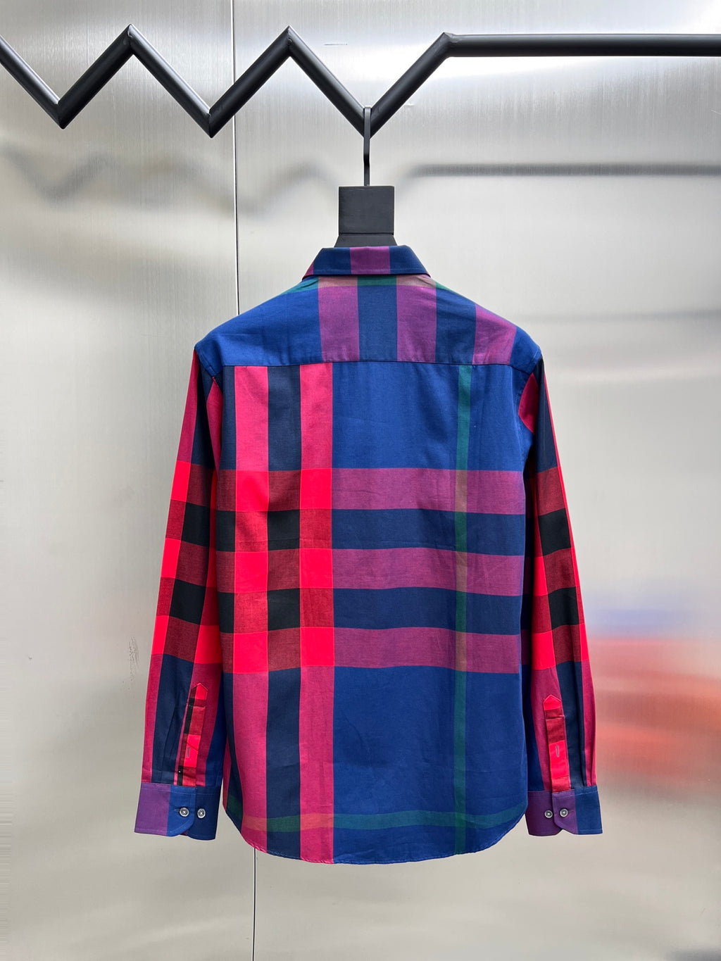 Plaid long-sleeve button-up shirt with blue, red, and purple checks, back view