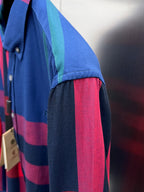 Plaid long-sleeve shirt sleeve with blue, teal, red, and purple block checks