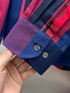 Blue plaid cuff with button placket and small pocket detail