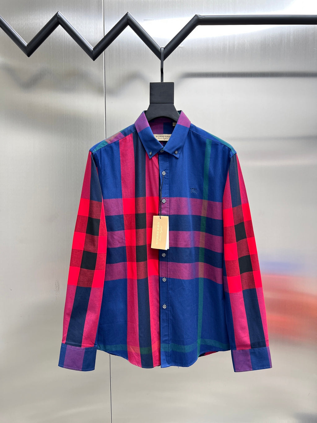 Plaid long-sleeve button-up shirt with blue, red, and purple checks, front view