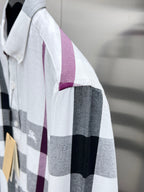 Long-sleeve button-up shirt sleeve in white, gray, and maroon plaid.
