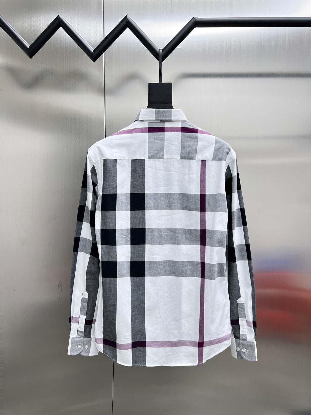 Long-sleeve button-up shirt, back view, white black and maroon plaid.