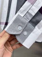 Long-sleeve shirt cuff with two buttons, white, gray, and plum plaid trim