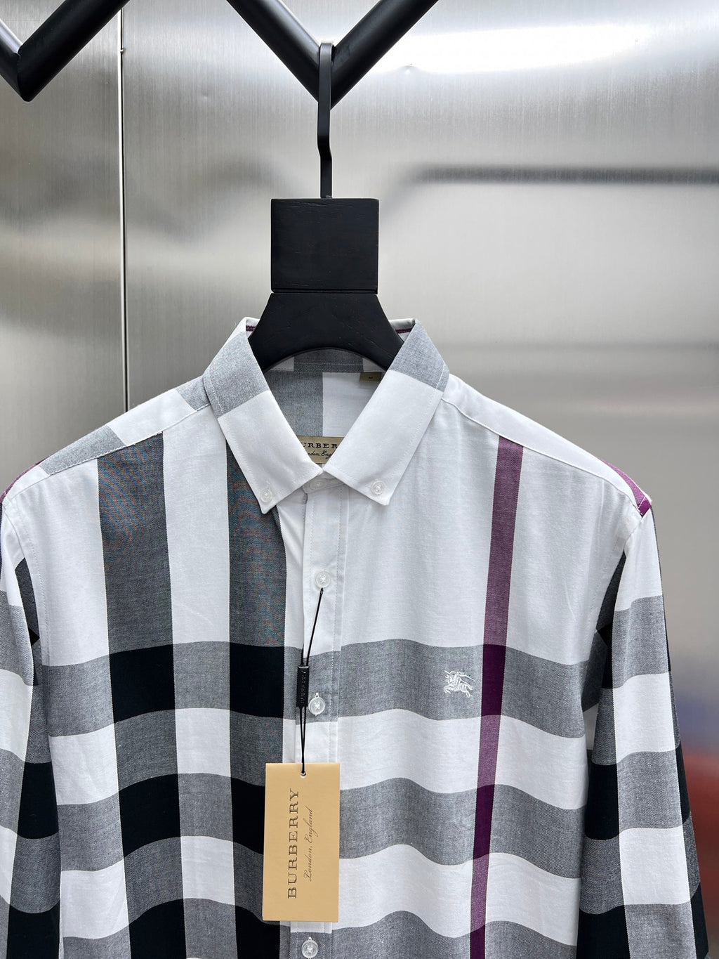 Burberry long-sleeve button-up shirt in white, black, and maroon plaid.