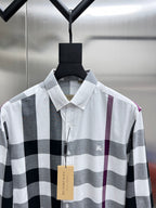 Burberry long-sleeve button-up shirt in white, black, and maroon plaid.