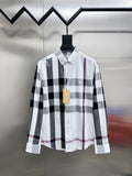 Long-sleeve button-up shirt in white, black, and maroon plaid.