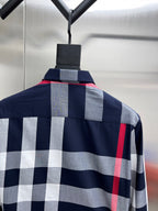 Plaid long-sleeve shirt on hanger, navy with gray and red check