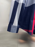 Long-sleeve plaid button-up shirt sleeve and hem with red accent stripe