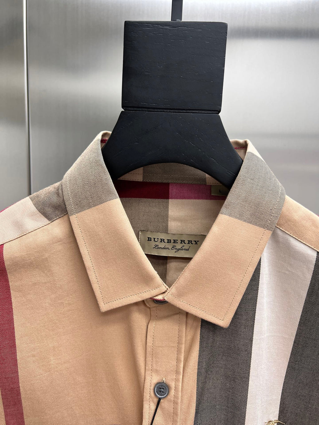 Burberry long-sleeve button-up shirt neckline with button placket and label
