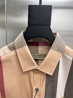 Burberry long-sleeve button-up shirt neckline with button placket and label