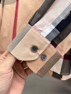 Beige long-sleeve shirt cuff with two-button placket and plaid check trim