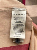 Burberry care label on beige long-sleeve shirt, made in Thailand