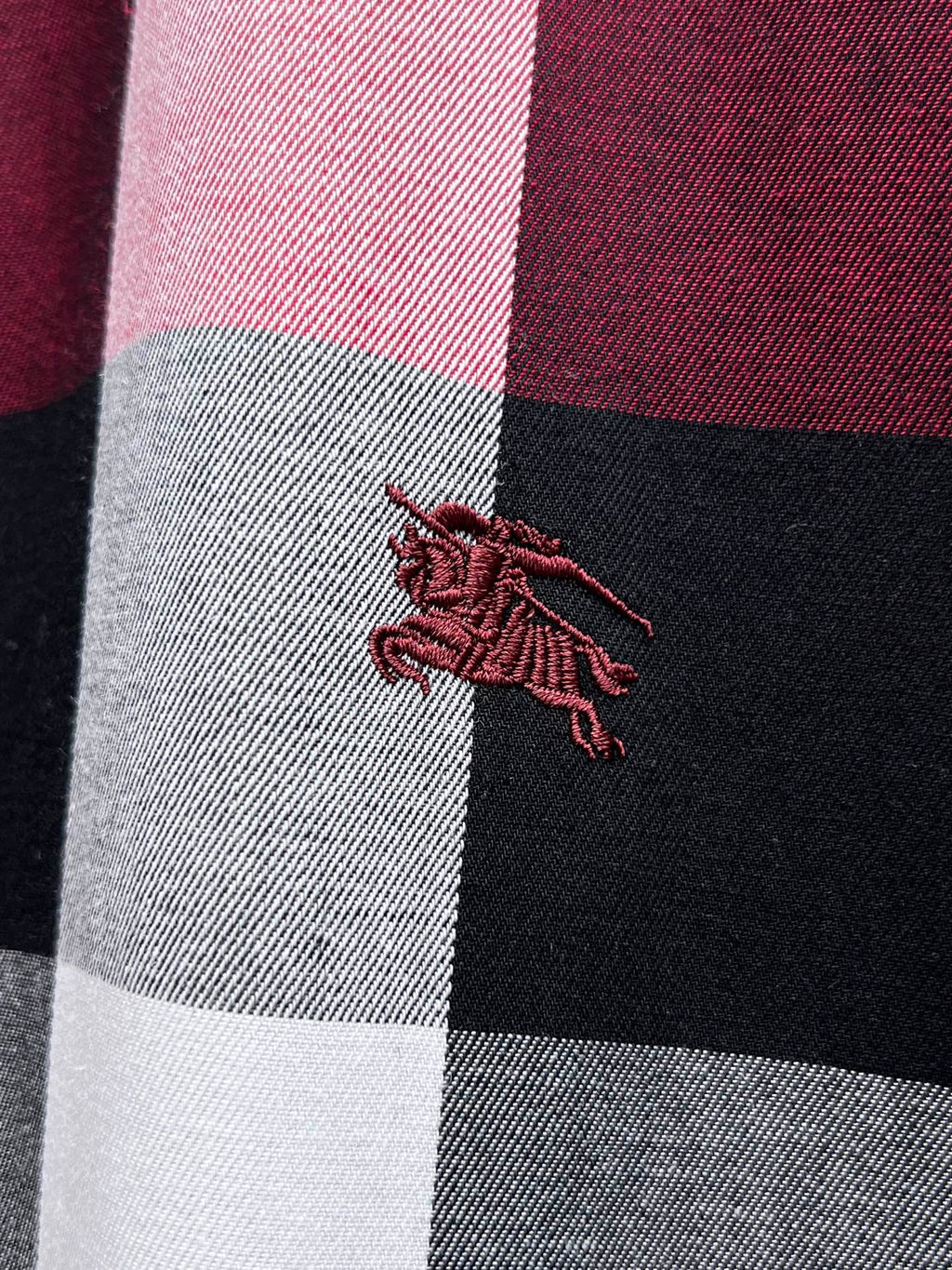 Burberry embroidered horse logo on plaid shirt panel