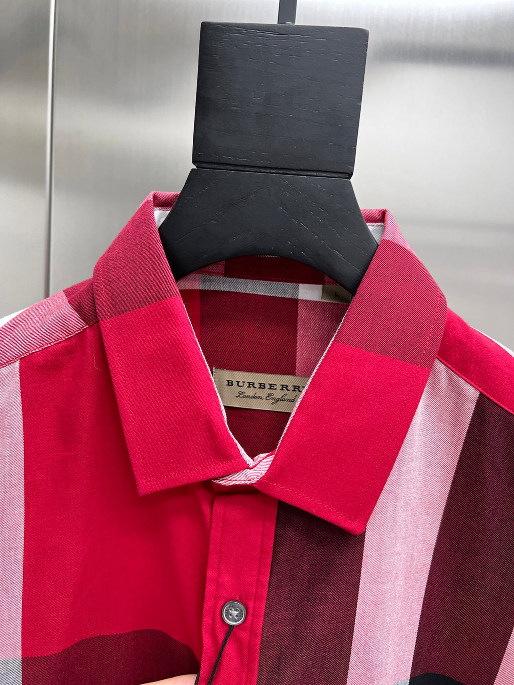 Burberry plaid shirt collar and neckline with hanging product tag