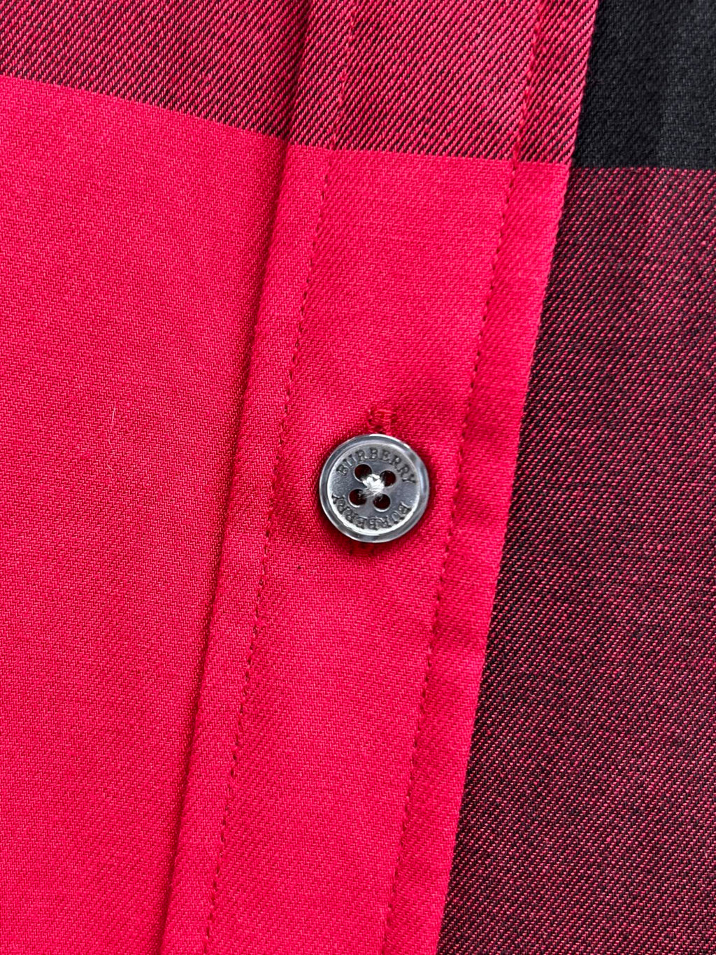 Burberry plaid shirt close-up of round button and seams